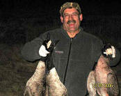 Picture of hunter holding three geese.