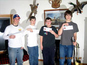 Picture of Kids with showing off their Scheel's gift certificates.